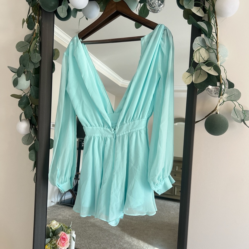 Mint green romper with open back and flowy sleeves #festivalvibes #romperlove